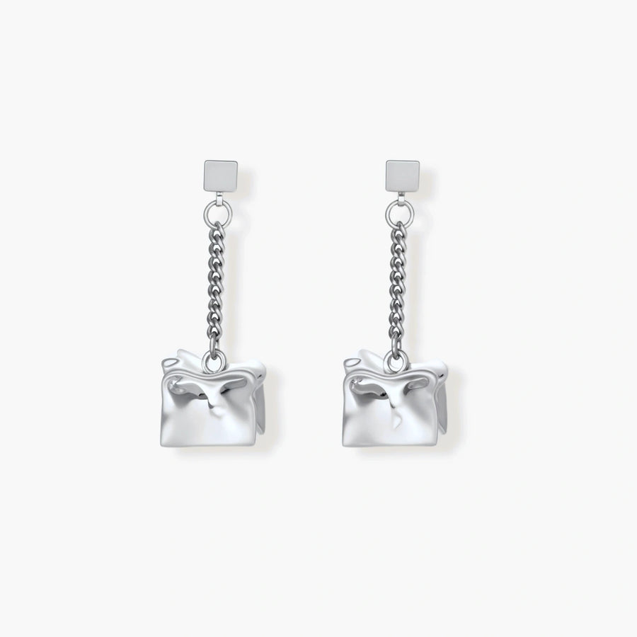 Geometric jewelry set with textured cube pendants on chains, featuring eco-zinc alloy in silver and gold finishes.