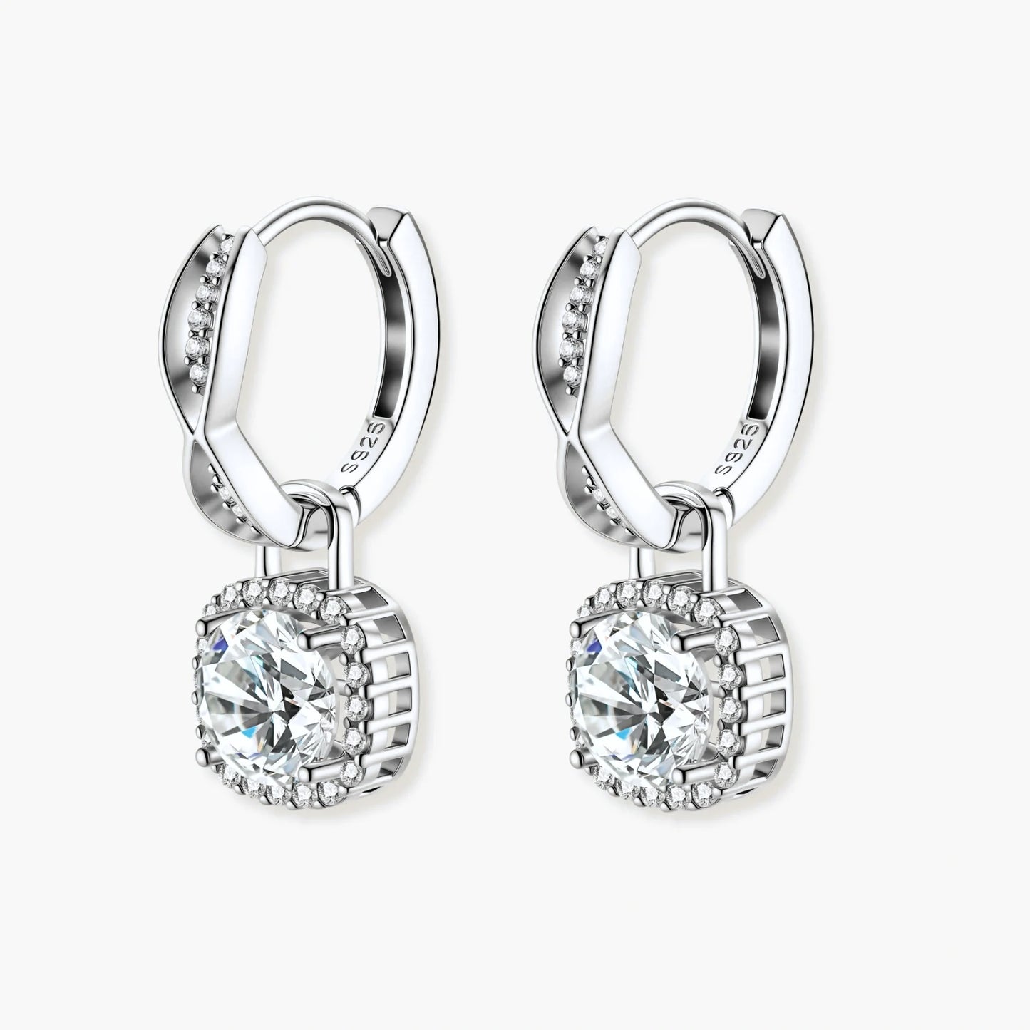 Sterling silver twisted hoop earrings with round moissanite stones in halo settings against neutral background.