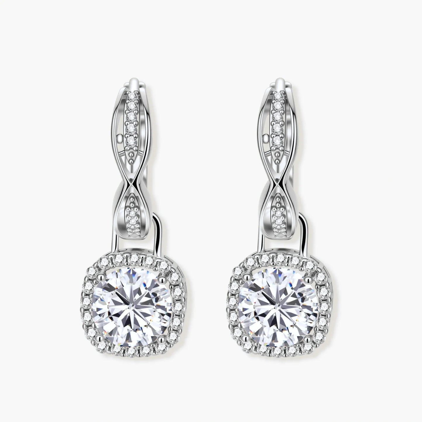 Sterling silver twisted hoop earrings with round moissanite stones in halo settings against neutral background.