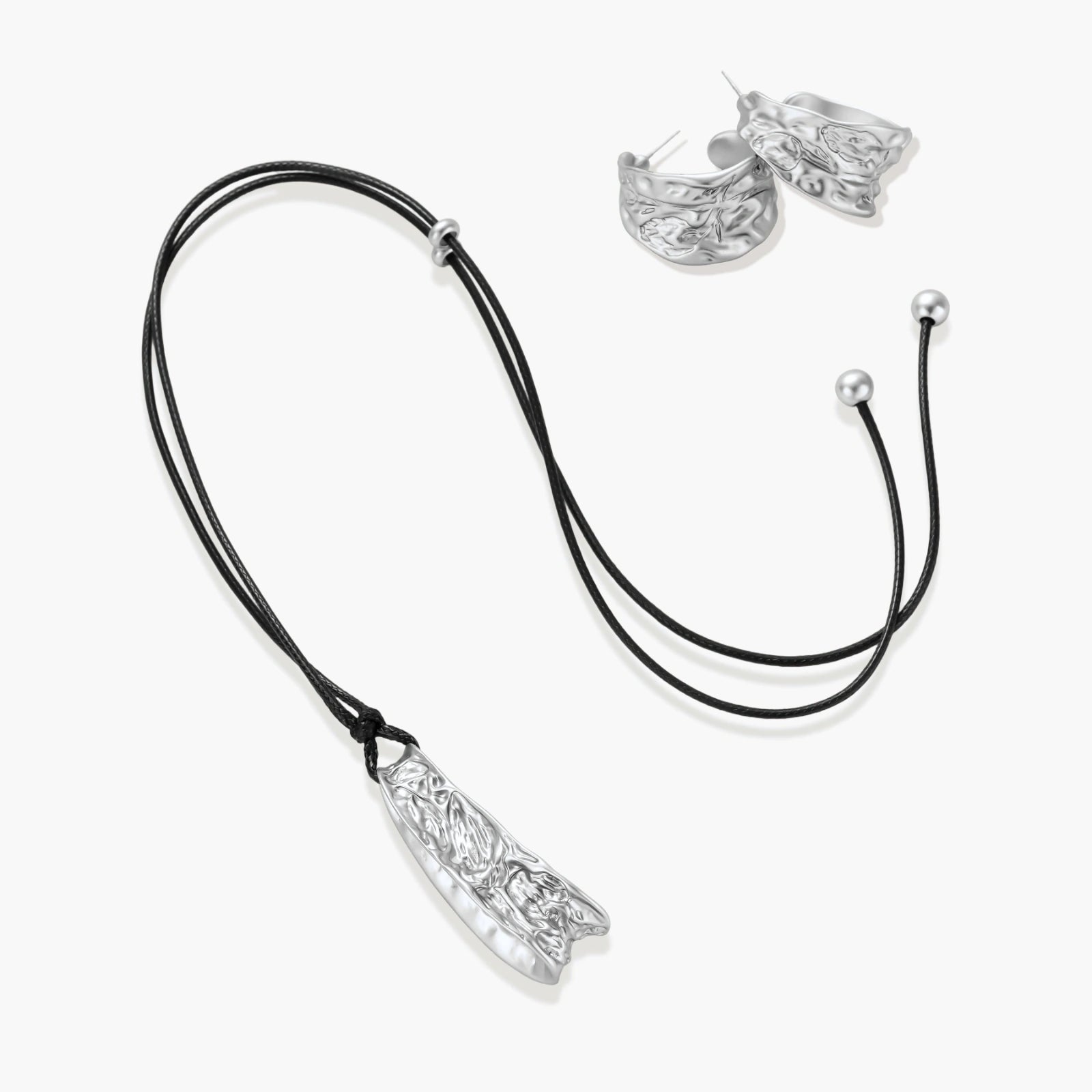 Textured silver jewelry set with floral engravings featuring adjustable cord necklace and matching hoop earrings