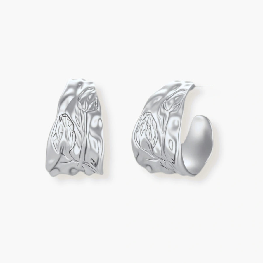 Textured silver jewelry set with floral engravings featuring adjustable cord necklace and matching hoop earrings